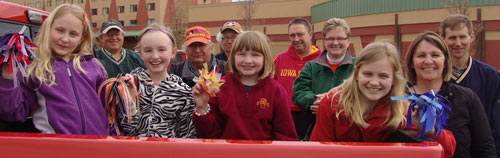 Children with mini pom-poms